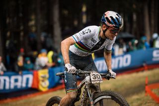 Tom Pidcock (Ineos Grenadiers) competing at a muddy MTB World Cup in Andorra